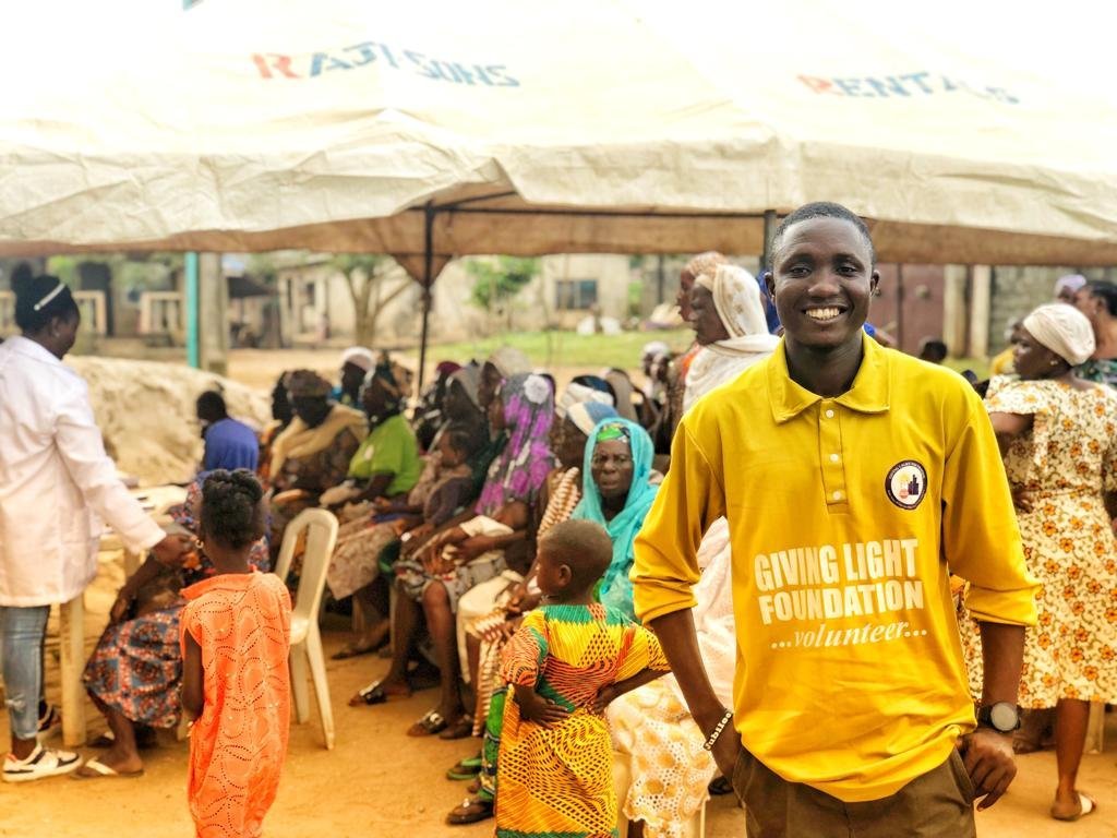 Giving Light Foundation volunteer at a community outreach